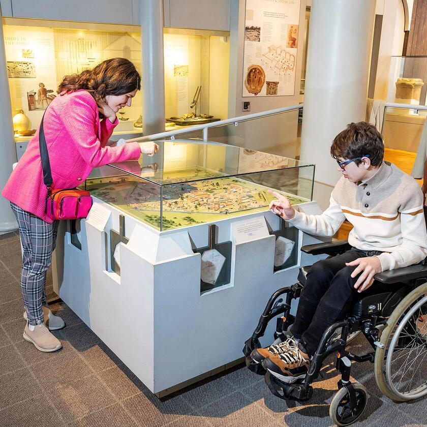 Young people looking at Roman Collection